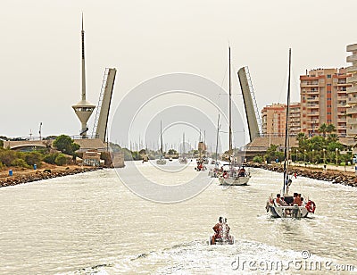 Yachts Passing under a Bridge Editorial Stock Photo