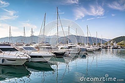 Yachts at the pier against mountains at dawn Stock Photo