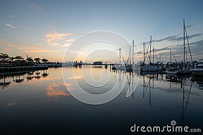 Yachts and sailboats docked in Dinner Key Marina in Miami in morning twilight. Editorial Stock Photo