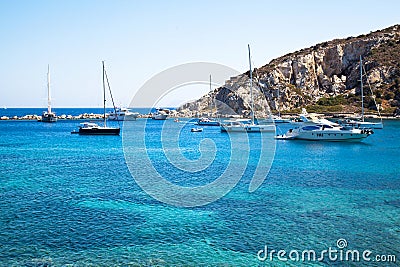 Yachts and ships waiting at the ancient city port of Knidos are on vacation.Turkey Mugla Datca, June 28 2023 Editorial Stock Photo
