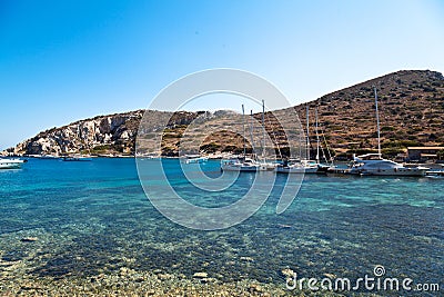 Yachts and ships waiting at the ancient city port of Knidos are on vacation.Turkey Mugla Datca, June 28 2023 Editorial Stock Photo