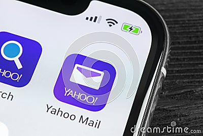 Yahoo Mail application icon on Apple iPhone X smartphone screen close-up. Yahoo mail app icon. Social network. Social media icon Editorial Stock Photo