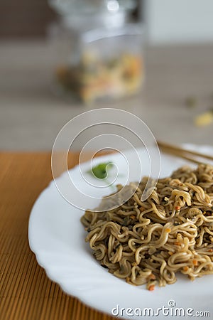 Yakisoba / noodles with beef in plate with bamboo stic Stock Photo