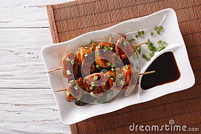 Yakitori chicken with green onions on a plate. Horizontal top vi Stock Photo