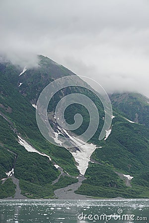 Yakutat Bay, Alaska, USA: Clouds descending on a mountainside Stock Photo