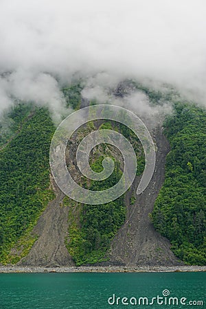 Yakutat Bay, Alaska, USA: Clouds descending on a mountainside Stock Photo