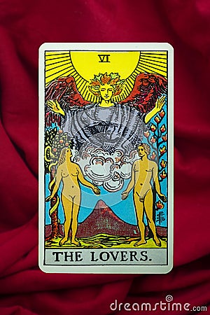 THE FOOL major tarot card of Rider Waite deck on red fabric background Stock Photo