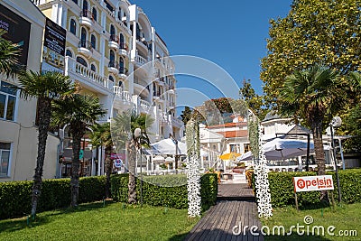 Outdoor cafe with evergreen palm trees, 09/03/2019, Yalta, Crimea Editorial Stock Photo