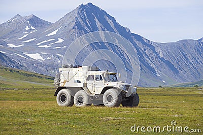 The Trekol all-terrain vehicle against the background of mountains of Polar Ural Editorial Stock Photo