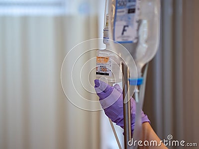 Yamanashi, Japan - 21.3.20: A nurse checking a patient`s iv drip in a hospital or clinic Editorial Stock Photo