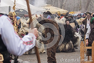 Winter masquerade festival Kukerlandia in Yambol town, Bulgaria. Editorial Stock Photo