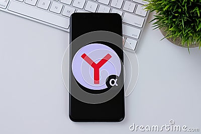 Yandex Browser alpha app logo on a smartphone screen. Editorial Stock Photo