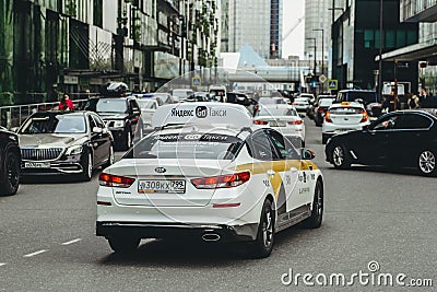 Yandex Taxi car near Moscow International Business Center street, Moscow-City skyscrapers. Editorial Stock Photo