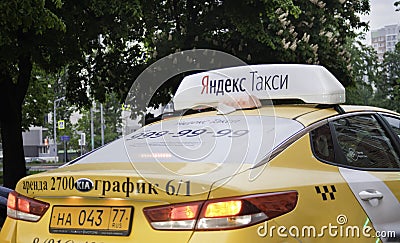 Yandex taxi on the street. Moscow Editorial Stock Photo
