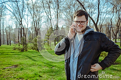 Yang man with smartphone in the park Stock Photo