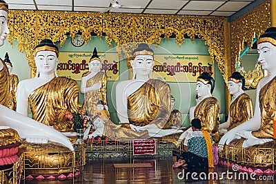 Yangon, Myanmar - FEB 19th 2014: Golden buddha statue at Shwedagon golden pagoda Editorial Stock Photo