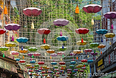 Beautiful picture of Chinese lights and decoration against foliage mountains Editorial Stock Photo