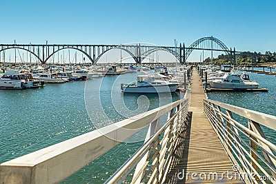 Yaquina Bay Bridge and a pier in Newport, OR Editorial Stock Photo