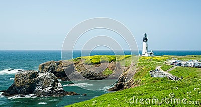 Yaquina Head Lighthouse with wildflowers Stock Photo