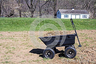 Yard cart full with grasses and dirt Stock Photo