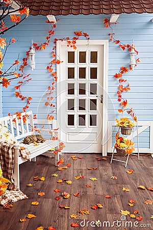 Yard of country house with tiling roof, blue wooden walls, white Stock Photo