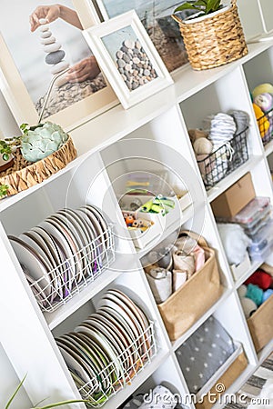Yarn storage organization textile hobby supplies contemporary cupboard shelves Stock Photo