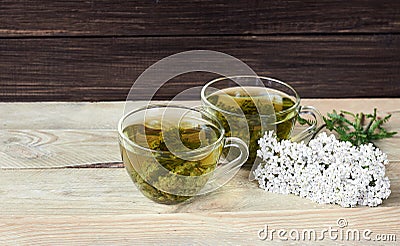 Yarrow herbal healing tea or decoction with fresh milfoil flowers Stock Photo