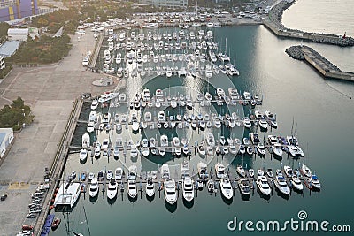 Yatch harbor marina pier and boat dock yatchs and vessels awaiting the open sea. Aerial drone view looking straight down above T- Stock Photo