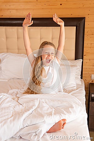 Yawns young sleep mobile girl phone beautiful bed blanket lying, for white relax in health from home attractive, room Stock Photo