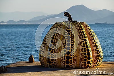 Yayoi Kusama`s yellow pumpkin sculpture in Naoshima, Japan Editorial Stock Photo