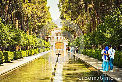 Yazd, Iran - 10th june, 2022: muslim tourist couple visit famous sightseeing attraction Dowlat Abad Garden , Yazd , Iran Editorial Stock Photo