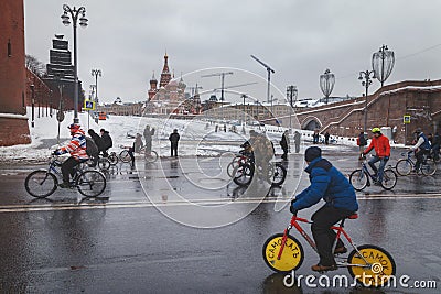 Cyclist rides on special bike along the Kremlin walls in winter. Editorial Stock Photo