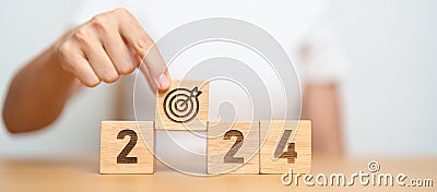 2024 year block with dartboard icon. Goal, Target, Resolution, strategy, plan, Action, mission, motivation, and New Year start Stock Photo