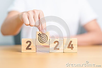 2023 year change to 2024 year block with dartboard icon. Goal, Target, Resolution, strategy, plan, Action, mission, motivation, Stock Photo