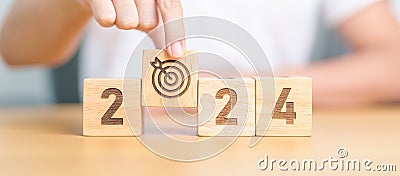 2023 year change to 2024 year block with dartboard icon. Goal, Target, Resolution, strategy, plan, Action, mission, motivation, Stock Photo