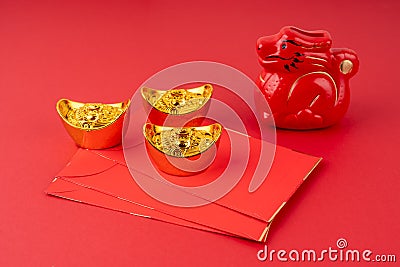 Year of the Dragon with red envelope and gold ingot Stock Photo