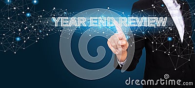 Year End Review concept with Hand of business pressing a button Stock Photo