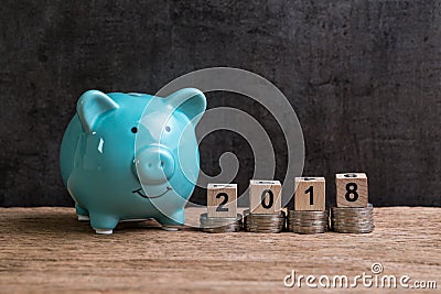 Year 2018 financial goal with piggy bank and stack of coins and Stock Photo