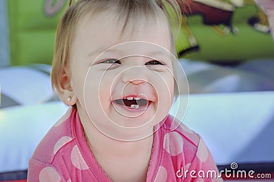 1 year little girl smiling in amusement parks. Stock Photo