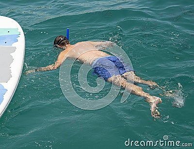 47 year-old Caucasian male tourist enjoying snorkeling in Santa Maria Bay near San Cabo Lucas Stock Photo
