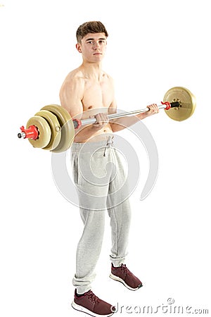 18 Year old teenage boy lifting weights Stock Photo