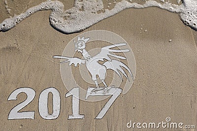 2017 year of the rooster on the beach Stock Photo