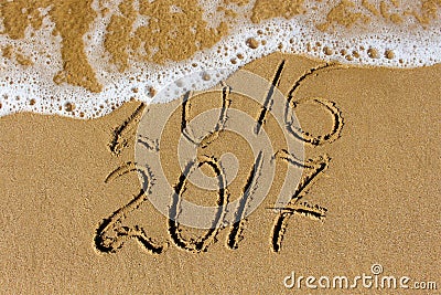 2016 and 2017 year written on beach sea. Stock Photo