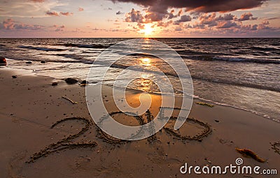 Year 2015 written on sand Stock Photo