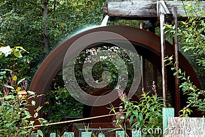 Sharpen your axes here at the water wheel Stock Photo