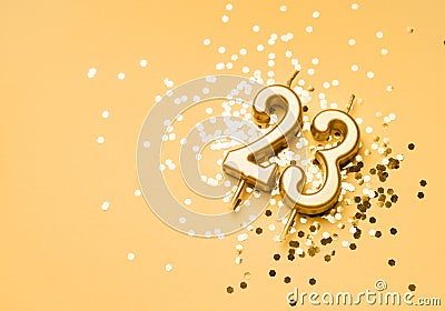 23 years birthday celebration festive background made with golden candle in the form of number Twenty three Stock Photo