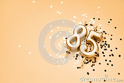 85 years celebration festive background made with golden candles in the form of number Eighty-five Stock Photo