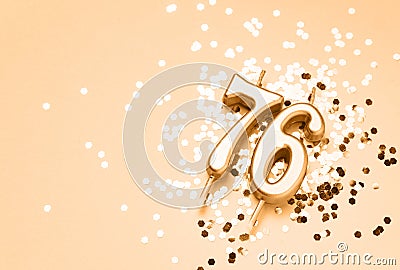 76 years celebration festive background made with golden candles in the form of number Seventy-six Stock Photo