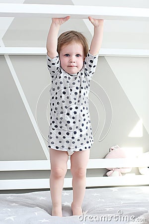 Cute 2 years little girl in her bed at home Stock Photo