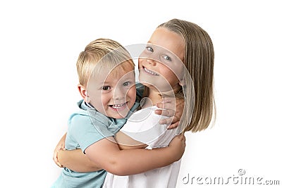 7 years old adorable blond happy girl posing with her little 3 years old brother smiling cheerful isolated on white background Stock Photo
